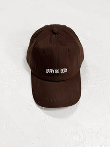 Chocolate brown cap featuring "Happy Go Lucky" text